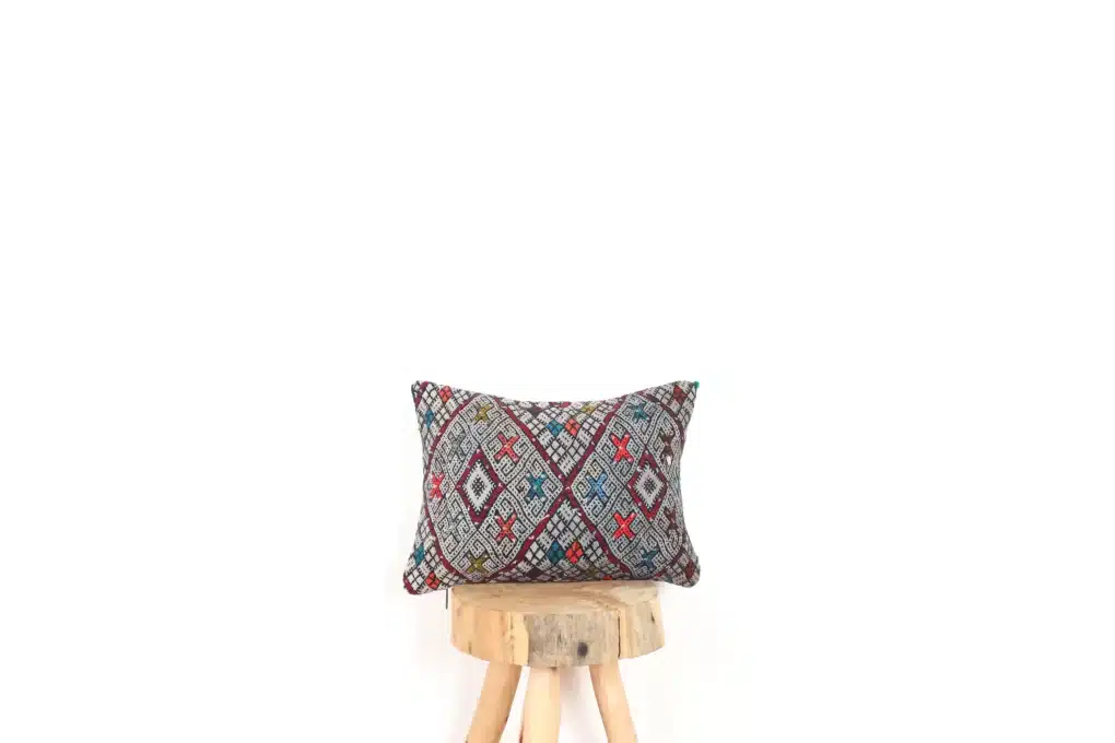 Moroccan-style floor pillows with intricate patterns and vibrant colors