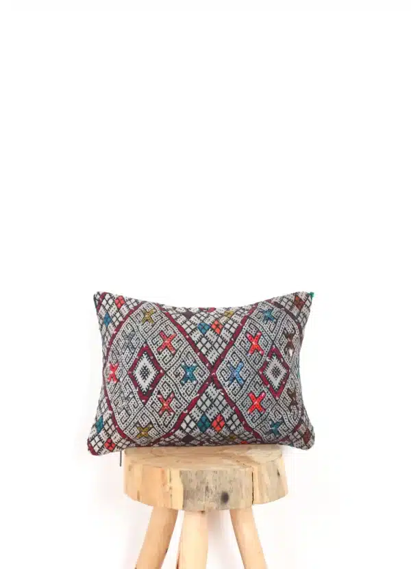Moroccan-style floor pillows with intricate patterns and vibrant colors