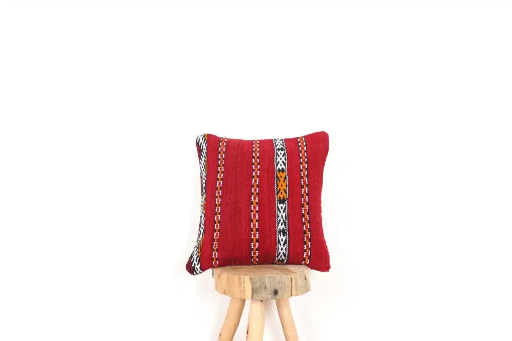 Moroccan cowhide pillows with intricate patterns and vibrant colors