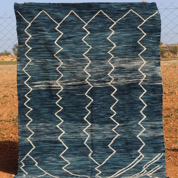 Handwoven Berber Kilim Rug with intricate patterns and earthy tones