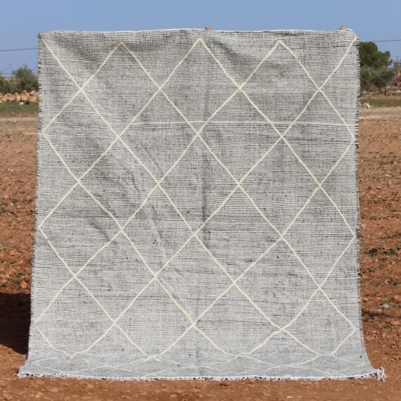 Handwoven Moroccan Kilim Rug with intricate geometric patterns and vibrant colors