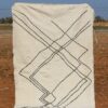 Minimalist White Beni Ourain Rug with simple geometric designs and luxurious wool texture