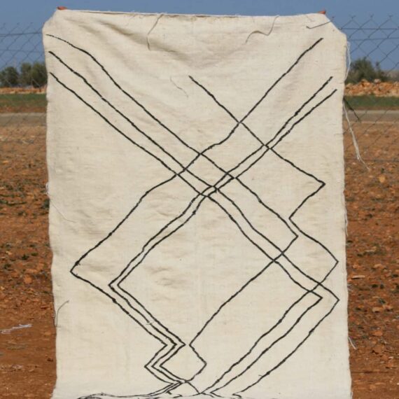 Minimalist White Beni Ourain Rug with simple geometric designs and luxurious wool texture