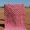 Moroccan Berber checkered rug in white and pink, handwoven with soft wool