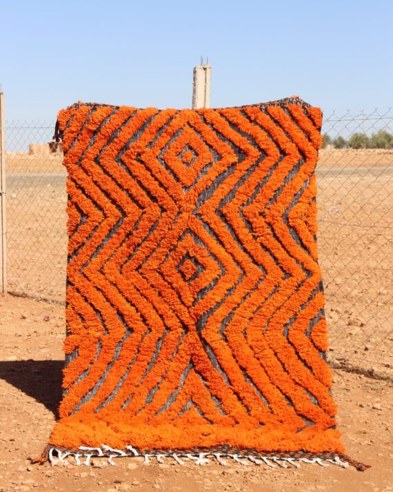 Handwoven Moroccan Rug Orange with bold abstract patterns for living room décor