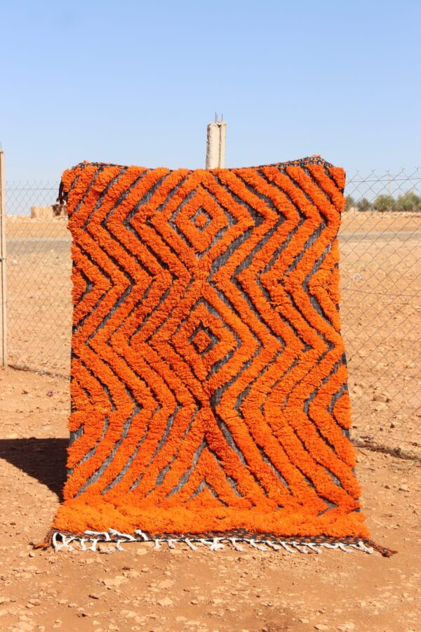 Handwoven Moroccan Rug Orange with bold abstract patterns for living room décor