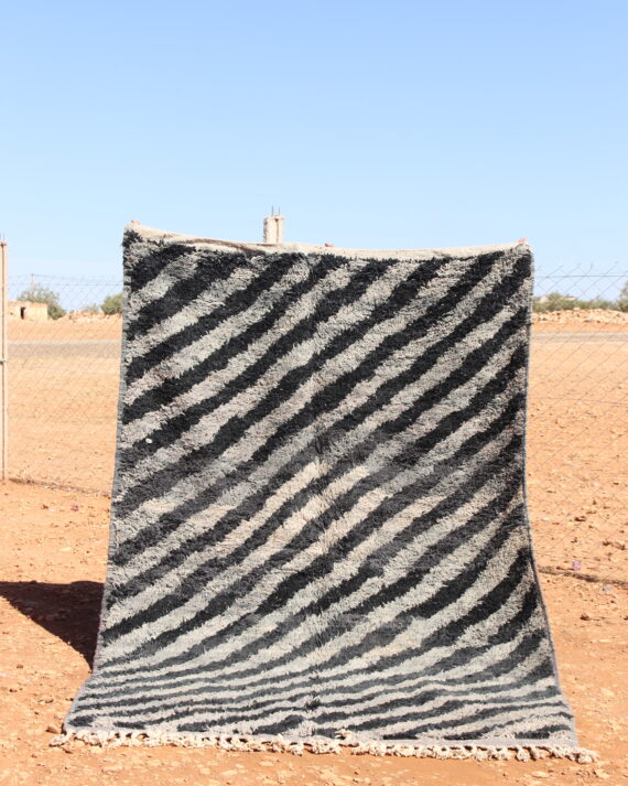 Abstract Rug in gray and black with intricate abstract patterns