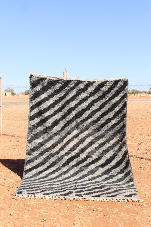 Abstract Rug in gray and black with intricate abstract patterns