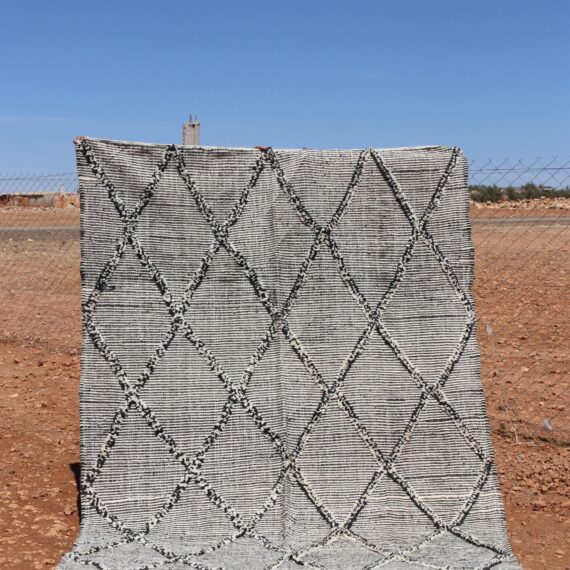 Woven Kilim Berber Rug with traditional patterns and earthy tones