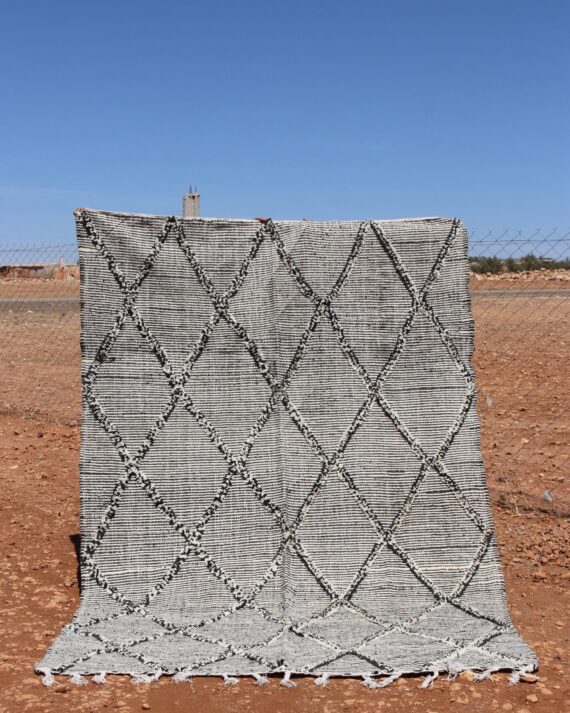 Woven Kilim Berber Rug with traditional patterns and earthy tones