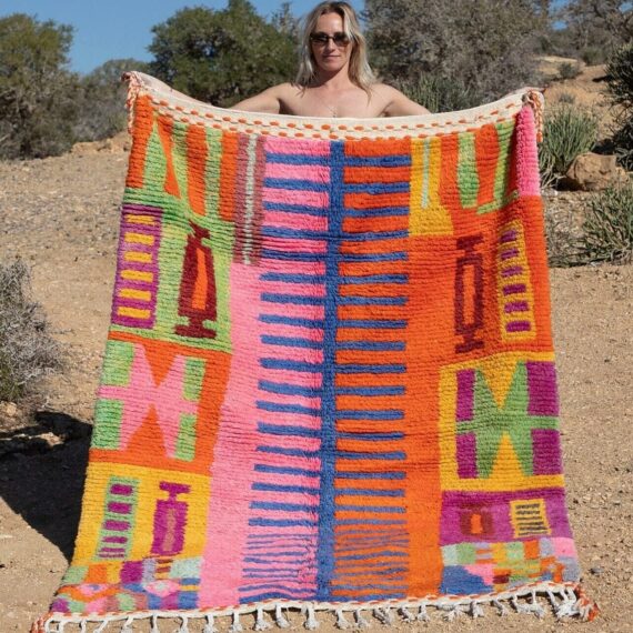 Abstract Colorful Moroccan Rug with intricate patterns in vibrant hues, displayed in a modern living room