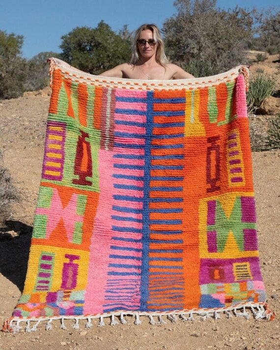 Abstract Colorful Moroccan Rug with intricate patterns in vibrant hues, displayed in a modern living room