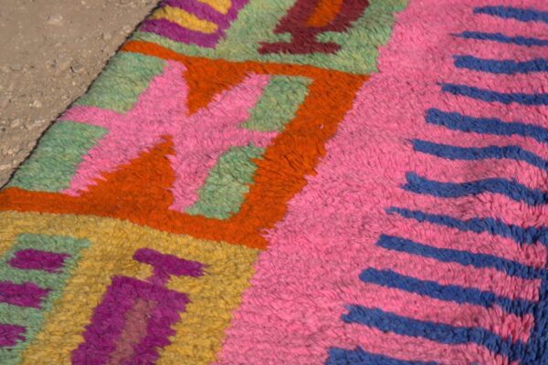 Abstract Colorful Moroccan Rug with intricate patterns in vibrant hues, displayed in a modern living room