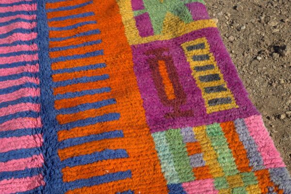 Abstract Colorful Moroccan Rug with intricate patterns in vibrant hues, displayed in a modern living room