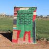 Handwoven Moroccan green Berber rug with geometric design