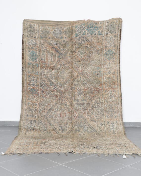Vintage Beni Mguild 10.2x5.8 Ft handknotted in Morocco with tribal motifs