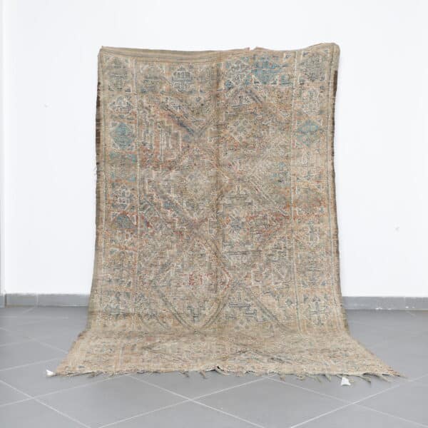 Vintage Beni Mguild 10.2x5.8 Ft handknotted in Morocco with tribal motifs
