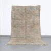 Vintage Beni Mguild 10.2x5.8 Ft handknotted in Morocco with tribal motifs