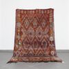 Vintage Zayan 9.5x5.7 Ft handknotted in Morocco with tribal Amazigh motifs