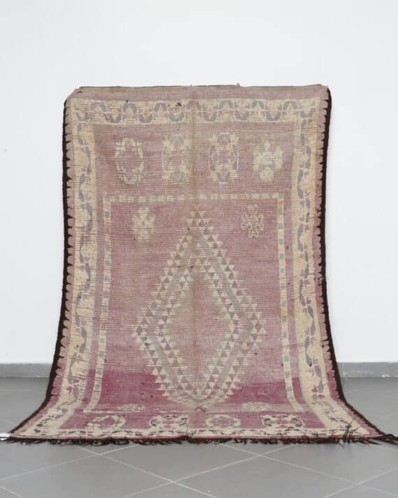 Vintage Oulad Bousbaa Rug 5.8x9.8 Ft handknotted in Morocco with tribal motifs