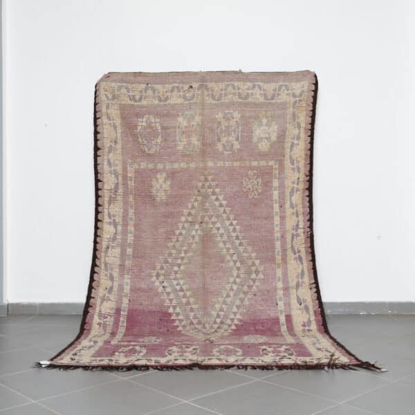 Vintage Oulad Bousbaa Rug 5.8x9.8 Ft handknotted in Morocco with tribal motifs