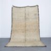 Vintage Beni Mguild 8.4x4.9 Ft handmade in Morocco with tribal motifs
