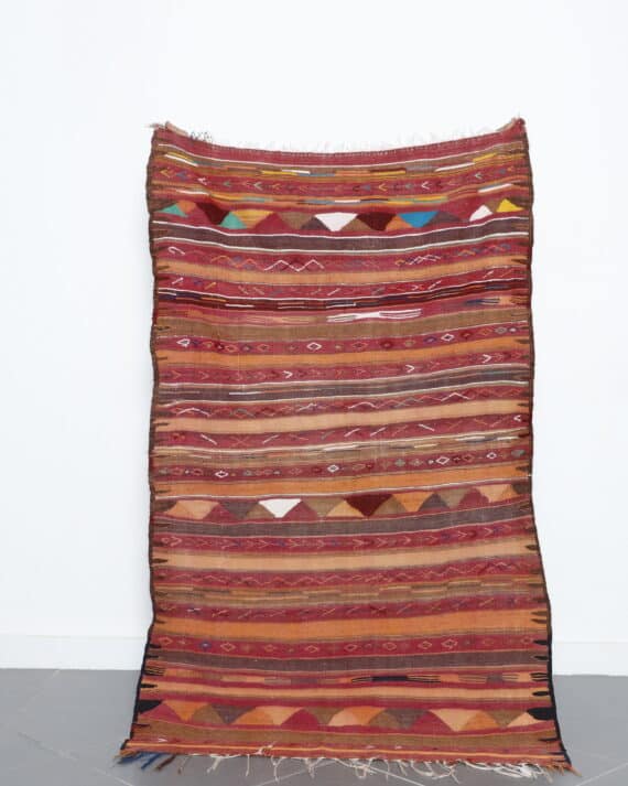 Vintage Moroccan kilim rug 5.7x3.6 Ft handmade with Berber motifs and earthy wool colors
