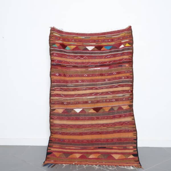 Vintage Moroccan kilim rug 5.7x3.6 Ft handmade with Berber motifs and earthy wool colors
