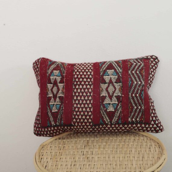 Handmade Moroccan kilim pillow with red Berber geometric patterns