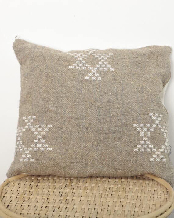 Moroccan square pillow handmade from vintage Berber textile with white tribal embroidery