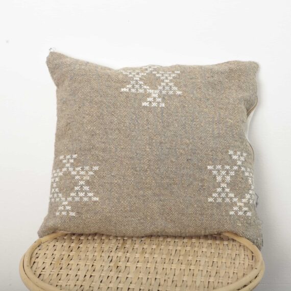 Moroccan square pillow handmade from vintage Berber textile with white tribal embroidery
